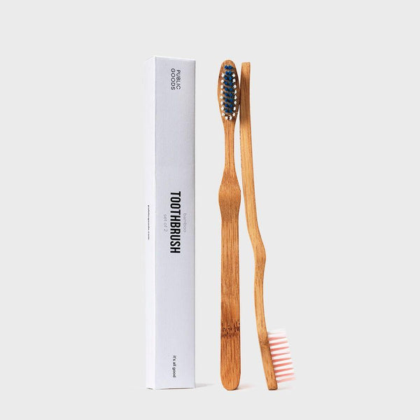 image of two bamboo toothbrushes from public goods