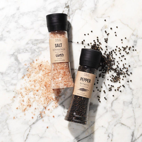 himalayan salt grinder, black peppercorn grinder, salt and pepper on granite countertop