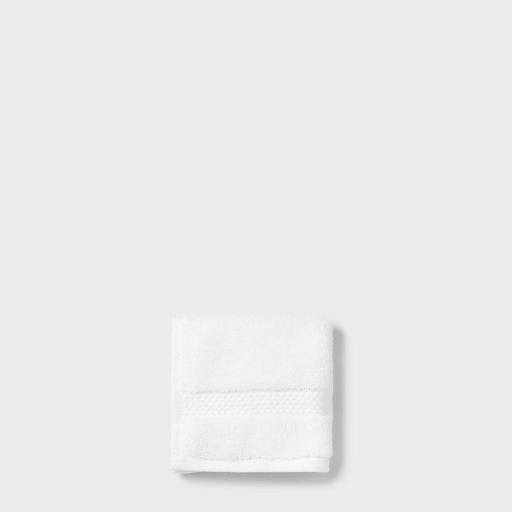 folded white cotton washcloth