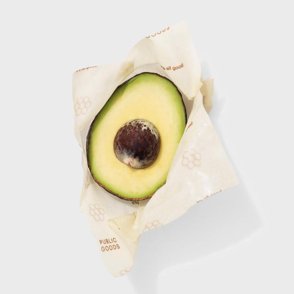 half of an avocado in food storage wrap